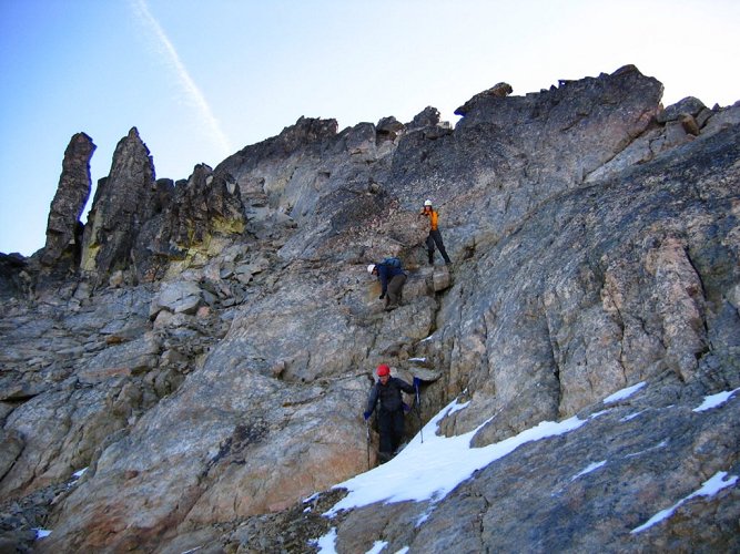 Here's the group descending the short step between the upper talus field and the main gully.
On our ascent, we took the larger gully near the striking gendarmes, which put us onto steeper terrain higher up.